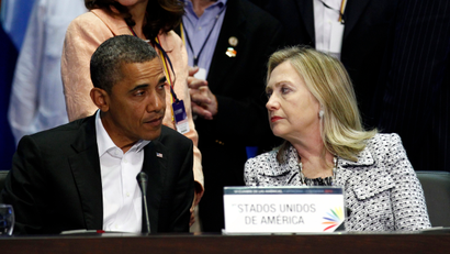 U.S. President Barack Obama and Secretary of State Hillary Clinton talk during the plenary session of the Summit of the Americas in Cartagena April 14, 2012. Obama tried on Saturday to convince skeptical Latin Americans that Washington has not turned its back on them, but ruled out a drug policy U-turn that some in the region want.