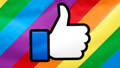 Facebook like icon/logo displayed on a rainbow pride background