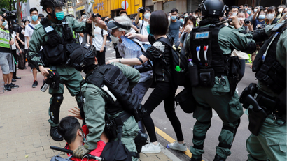 Anti-government demonstrators scuffle with riot police in Hong Kong on May 27.