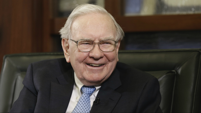 In this file photo from May 5, 2014, Berkshire Hathaway Chairman and CEO Warren Buffett laughs in Omaha, Neb. The San Francisco homeless charity that benefits from the annual auction of a private lunch with Warren Buffett hopes another buyer will be willing to pay more than $1 million for the privilege again this year. Already, Buffett has raised nearly $16 million for the Glide Foundation over the past 14 years. This year’s online auction starts Sunday and runs through 9:30 p.m. Central on Friday, June 6. (AP Photo/Nati Harnik)