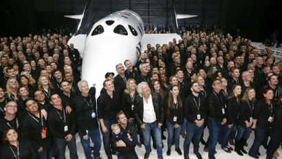 Richard Branson poses after unveiling the new SpaceShipTwo, a six-passenger two-pilot vehicle meant to ferry people into space that replaces a rocket destroyed during a test flight in October 2014, in Mojave, California, United States,