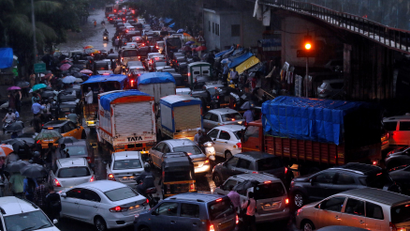 Vehicles are seen stuck in a traffic jam at an intersection after rains in Mumbai