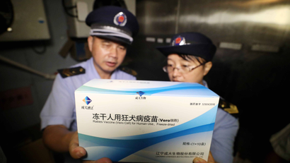 Law enforcement personnel from the market supervision and administration bureau check the vaccine supply in Rongan, China, 23 July 2018. Chinese Premier Li Keqiang has ordered new investigations into China's DPT vaccine scandal. Thousands of DPT vaccines, which are used to inoculate children against pertussis, diphtheria, and tetanus were found ineffective, according to the Chinese media.