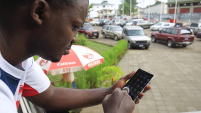 A man using a cellphone in Monrovia, Liberia 15 April 2016.
