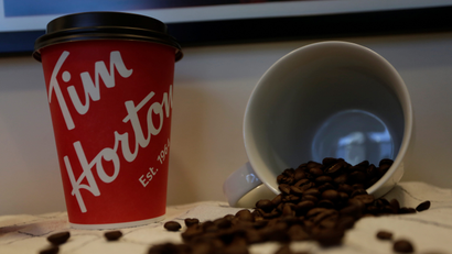 A Tim Hortons coffee cup and coffee beans are displayed at the coffee shop during a media event a day before its opening in San Pedro Garza Garcia, neighboring Monterrey