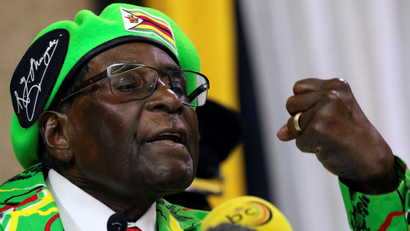 Tanks roll toward Zimbabwe’s capital after army chief threatens to “step in”