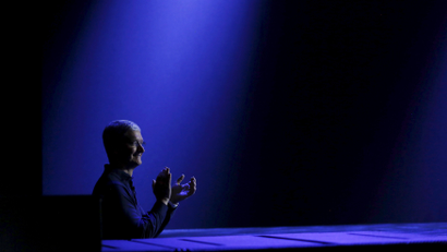 Apple CEO Tim Cook waits to return to stage during his keynote address at the Worldwide Developers Conference in San Francisco