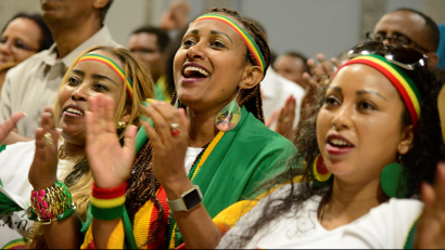 Members of the Ethiopian diaspora, the largest outside of Ethiopia, cheer as they respond to remarks by Ethiopia's Prime Minister Abiy Ahmed, calling on them to return, invest and support their native land with the theme "Break The Wall Build The Bridge", in Washington, U.S., July 28, 2018.