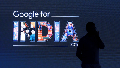 Man stands in front of a screen during a Google event in New Delhi