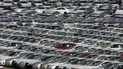 Cars produced at the Subaru of Indiana Automotive Manufacturing Plant in Lafayette, Ind., sit in a holding lot outside the factory Saturday, Feb. 28, 2009.