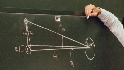 physics equation on blackboard