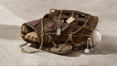 A worn baseball glove is draped in Tiffany's new jewelry for dudes