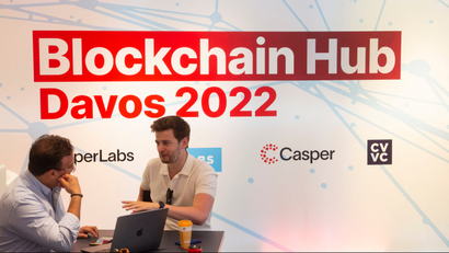 People are seen at the Blockchain Hub Davos 2022 in Davos