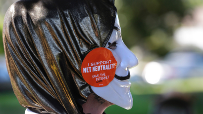 A pro-net neutrality Internet activist attends a rally in the neighborhood where U.S. President Barack Obama attended a fundraiser in Los Angeles, California July 23, 2014.