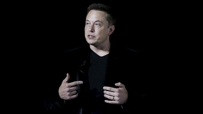Tesla Motors CEO Elon Musk delivers Model X electric sports-utility vehicles during a presentation.