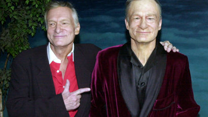 HUGH HEFNER POSES AT HOLLYWOOD WAX MUSEUM UNVEILING.