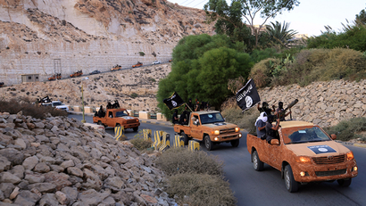 An armed motorcade belonging to members of Derna's Islamic Youth Council, consisting of former members of militias from the town of Derna, drive along a road in Derna, eastern Libya October 3, 2014. The group pledged allegiance to the Islamic State on October 3, 2014 local media reported. Picture taken October 3, 2014.