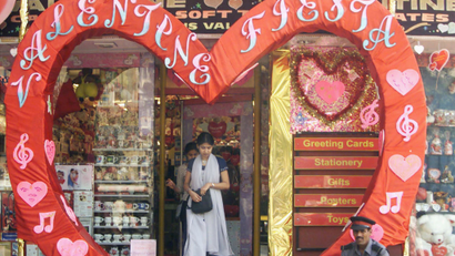 A VALENTINE'S DAY HEART FRAMES THE ENTRANCE TO A SHOP IN BOMBAY.