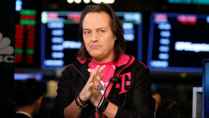 T-Mobile CEO John Legere prepares for an interview on the floor of the New York Stock Exchange in New York