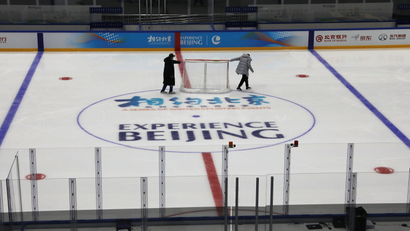 Olympics staff prepare a hockey venue in Beijing, China.