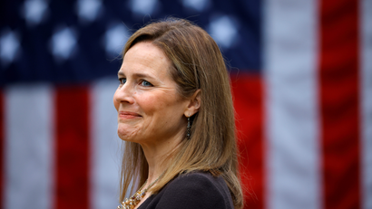 A close-up picture of Supreme Court nominee Amy Coney Barrett, a US Court of Appeals Seventh Circuit Judge, in front of an American flag during the presidential announcement event.