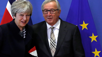 Britain's PM May is welcomed by EU Commission President Juncker at the European Commission in Brussels