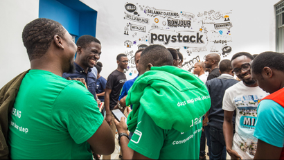 A room of people wearing Paystack branded material at Paystack's offices in Lagos, Nigeria
