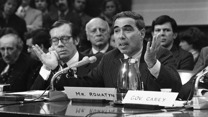 Felix Rohatyn, chairman of Municipal Assistance Corporation, press members of a House economic stabilization subcommittee on Tuesday, Oct. 21, 1975 in Washington, to enact legislation to aid deficit-ridden New York City. Carey said unless a bill is on President Ford?s desk by early November, both the city and state will go into default. (AP Photo/Charles Gorry