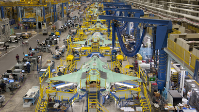 Workers can be seen on the moving line and forward fuselage assembly areas for the F-35 Joint Strike Fighter at Lockheed Martin Corp's factory located in Fort Worth, Texas in this October 13, 2011 handout photo provided by Lockheed Martin. Lockheed Martin Corp on February 25, 2013 said there was no evidence that a lithium-ion battery contributed to a Feb. 14 incident that caused smoke in the cockpit of an F-35 test plane. Lockheed spokesman Michael Rein said initial reviews indicated a potential failure in the plane's cooling system, which had been removed from the aircraft for further study. Picture taken October 13, 2011.