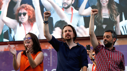 Pablo Iglesias (center) leads a coalition of far-left, anti-establishment political parties that just might clinch a majority in Spain’s parliamentary elections on Sunday.