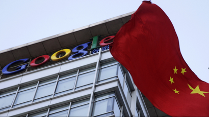 A Chinese flag flutters near the Google logo on top of Google's China headquarters in Beijing, China, Friday, Jan. 22, 2010. U.S. Secretary of State Hillary Rodham Clinton on Thursday urged China to investigate cyber intrusions that led search angle Google to threaten to pull out of that country, and challenged Beijing to openly publish its findings. (AP Photo/Ng Han Guan
