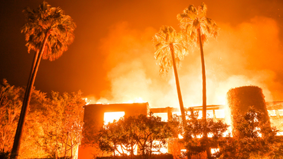 The Woolsey fire burns homes in Malibu, Calif., Friday, Nov. 9, 2018.