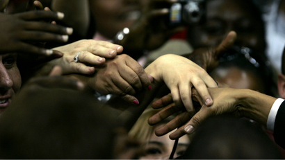 Supporters reach out to touch the hand of democratic presidential candidate Barack Obama in 2008.