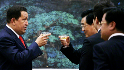 Chinese President Hu Jintao, right, and Venezuelan President Hugo Chavez toast after a ceremony to sign agreements between the two nations at the Great Hall of the People in Beijing Wednesday, Sept. 24, 2008. Chavez said his country's oil exports to China could soar to 1 million barrels a day by 2012. Chavez's visit this week to Beijing has focused on trade and business ties, including refinery construction deals and China's launch of a Venezuelan communications satellite. (AP Photo/ Elizabeth Dalziel
