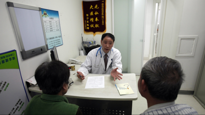 Doctor Lu Ankang talks with patients with respiratory problems caused by smoking at Ruijin Hospital in Shanghai April 27, 2011. China will ban smoking at all indoor public venues from May 1, in an effort to shield the world's most populous nation, and its largest cigarette producer, from the harmful effects of the habit, the health ministry said. China, which has more than 300 million smokers, will require businesses to display prominent no-smoking signs, forbid vending machines from selling cigarettes and ensure that designated outdoor smoking zones not affect pedestrian traffic. Although nearly 1.2 million Chinese people die from smoking-related diseases each year, the habit is deeply entrenched in public life. Picture taken April 27, 2011. REUTERS/Carlos Barria