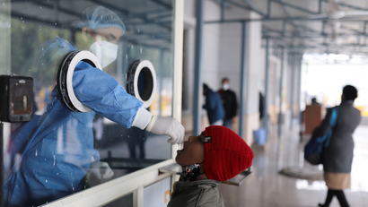A healthcare worker collects a test swab sample from a child amidst the spread of the coronavirus disease (COVID-19), at a testing centre inside a hospital in New Delhi, India, January 14, 2022.