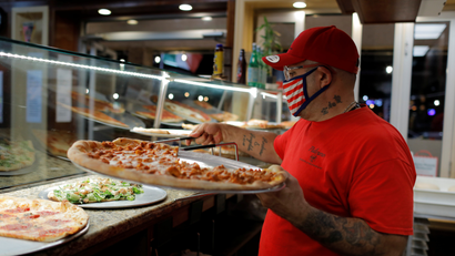Sal Finocchiaro, 51, prepares pizza at Palermo Pizzeria and Restaurant, which he co-owns, on Staten Island in New York City, U.S., October 10, 2020. Picture taken October 10, 2020.
