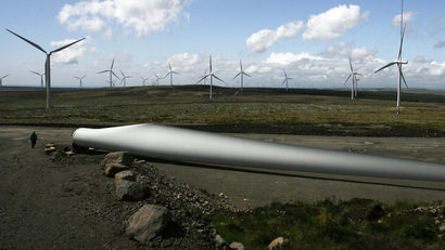 A man walks next to a wind turbine blade at the Whitelee Windfarm near Eaglesham, East Renfrewshire, in Scotland May 20, 2009.