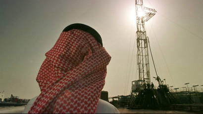 Khaled al Otaiby, an official of the Saudi oil company Aramco, watches progress at a rig at the al-Howta oil field near Howta, Saudi Arabia.