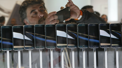 A row of smartphones are seen on display at the Mobile World Congress in Barcelona March 1, 2015.
