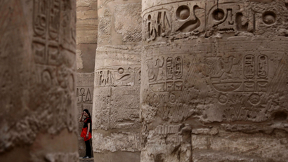 A tourist stands in Karnak Temple in Luxor, southern Egypt, November 9, 2009