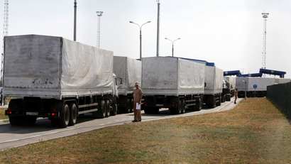 Trucks of a Russian convoy carrying humanitarian aid for Ukraine drive onto the territory of a Russia-Ukraine border crossing point "Donetsk" in Russia's Rostov Region, August 22, 2014