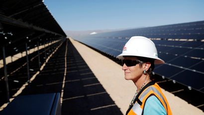 FILE - In this Sept. 15, 2016, file photo, then Secretary of the Interior Sally Jewell tours a solar project site on the Moapa River Indian Reservation about 40 miles northeast of Las Vegas. Elected officials and tribal leaders helped Friday, March 17, 2017, to power up the vast sun-to-electricity array that, in 2012, was the first utility-scale power production plant approved by the U.S. Interior Department on Indian land nationwide.