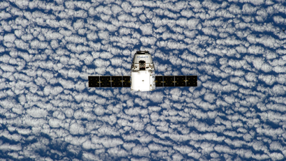 This photo provided by NASA is one of an extensive series of still photos documenting the arrival and ultimate capture and berthing of the SpaceX Dragon capsule at the International Space Station, as photographed by the Expedition 39 crew members onboard the orbital outpost Sunday April 20, 2014.