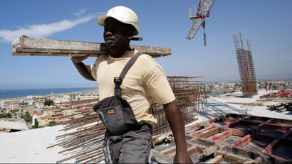 Kamara, 29, a migrant from Guinea, works at the construction site of a building in Algiers, Algeria June 29, 2017. Picture taken June 29, 2017.