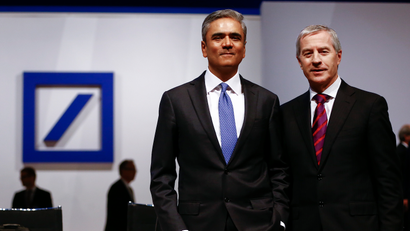 Anshu Jain (L) and Juergen Fitschen, co-CEOs of Deutsche Bank, pose before the bank's annual general meeting in Frankfurt, Germany, May 21, 2015. Deutsche Bank reshuffled its management board late on Wednesday, consolidating restructuring authority under co-Chief Executive Anshu Jain while bidding farewell to its retail banking head Rainer Neske. The reshuffle comes one day before the German bank holds what promises to be a stormy annual general meeting after shareholders openly expressed dismay at lagging profits, soaring fines and sluggish reforms. REUTERS/Kai Pfaffenbach - RTX1DWK8