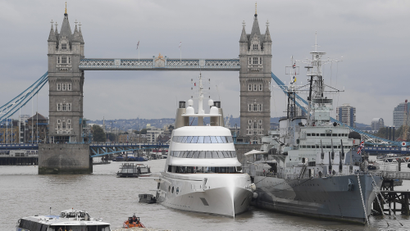 A Russian-owned superyacht next to the HMS Belfast on the Thames.