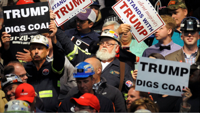 Trump digs coal signs