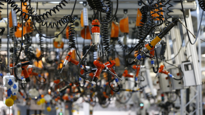 Various tools are seen hanging from the ceiling at the engine manufacturing unit for the new Mercedes AMG GT super sports cars during a factory tour for journalists at the Mercedes AMG headquarters in Affalterbach near Stuttgart, September 9, 2014. According to AMG, each engine for the new sports car will be manufactured by hand from a worker, with his personalized name plate on it. The new Mercedes AMG GT, from German car manufacturer Mercedes' sports car unit AMG, will be unveiled during a World Premier party on September 9. REUTERS/Kai Pfaffenbach (GERMANY - Tags: TRANSPORT BUSINESS EMPLOYMENT SPORT MOTORSPORT)