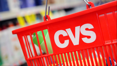 A shopping basket with the CVS logo.